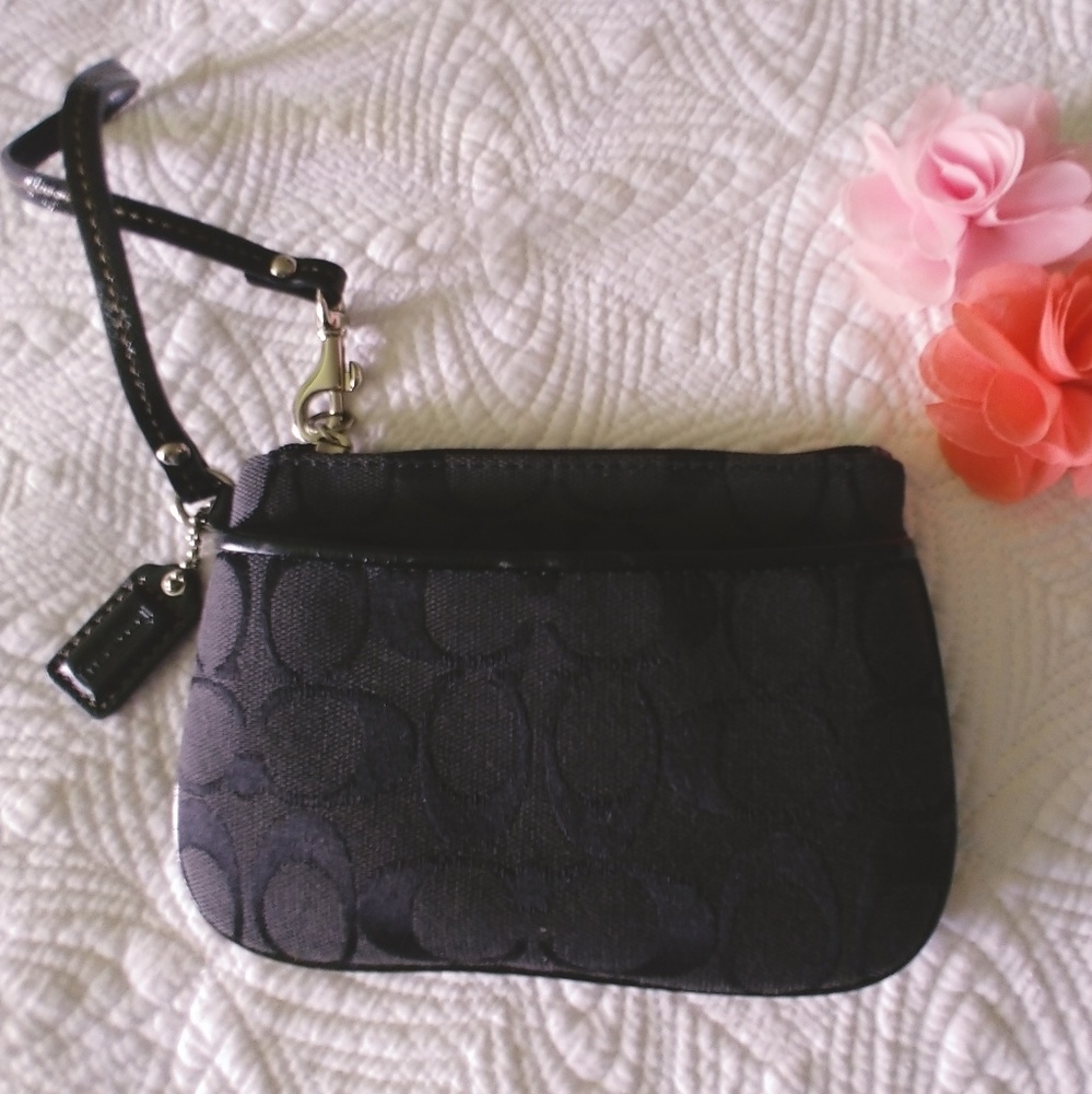 Signature coach wristlet.